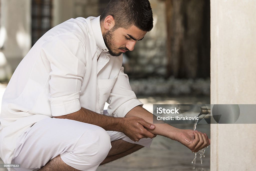 Islamic Religious Rite Ceremony Of Ablution Hand Washing Muslim Man Preparing To Take Ablution In Mosque Adult Stock Photo