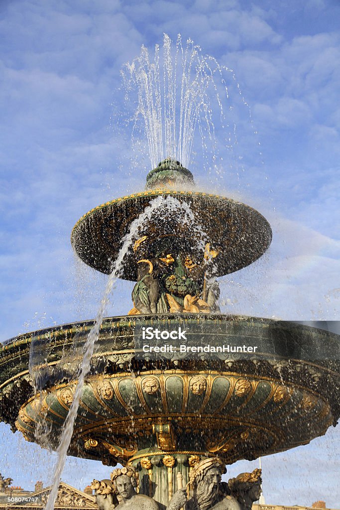 Arcing Fountain One of the Fontaines de la Concorde, monumental fountains in  the Place de la Concorde at the heart of Paris.  Architecture Stock Photo