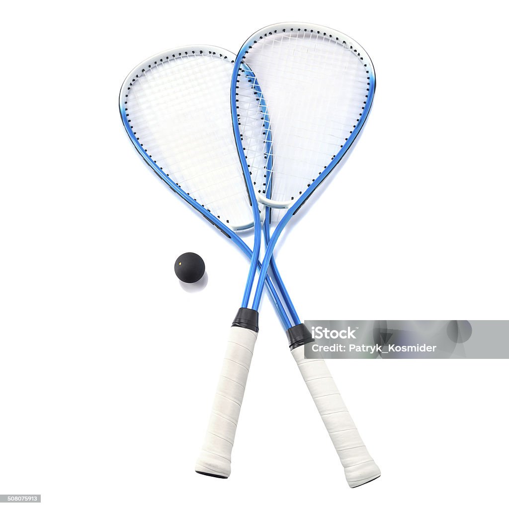 Squash rackets and balls Close up of a squash rackets and balls isolated over white Squash - Sport Stock Photo