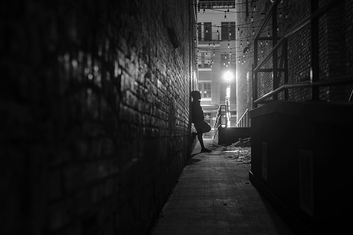 Dark alley showing glimmer of light