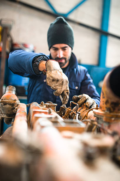 istock mechanic working in a workshop on a truck engine 508089980