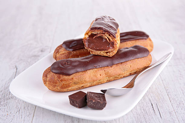 french dessert,eclair french dessert,eclair choux pastry photos stock pictures, royalty-free photos & images