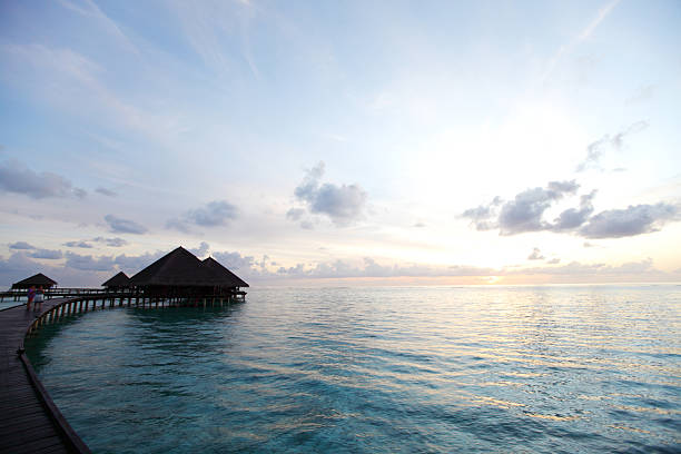 istock maldivian houses on sunrise 508092857