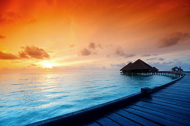 istock maldivian houses on sunrise 508092877