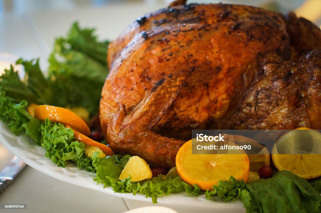 Turkey with leaves and oranges for christmas and thanksgiving Turkey With Leaves And Oranges For Christmas And Thanksgiving Baked Stock Photo