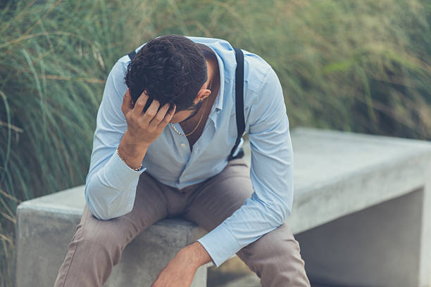 istock Young handsome man  sitting on a concrete bench 508094942