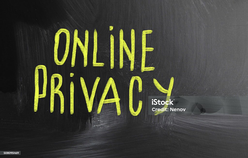 privacy handwritten with chalk on a blackboard Confidential - Single Word Stock Photo