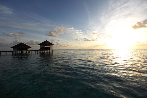 istock maldivian houses on sunrise 508096045
