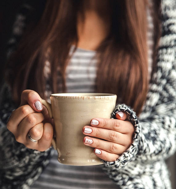 istock Girl's hands holding cup of coffee 508096272