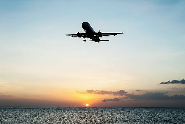 Plane with sky sunset and sea