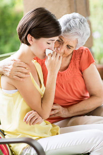 istock Senior woman hugging woman crying 508096539