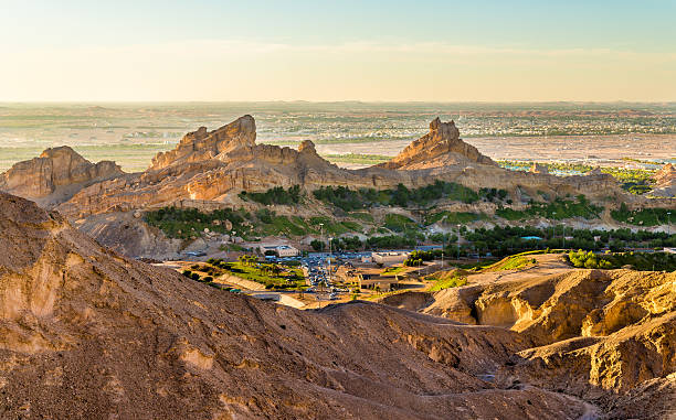 Green Mubazzarah resort as seen from Jabel Hafeet mountains, UAE Green Mubazzarah resort as seen from Jabel Hafeet mountains, UAE jebel hafeet stock pictures, royalty-free photos & images