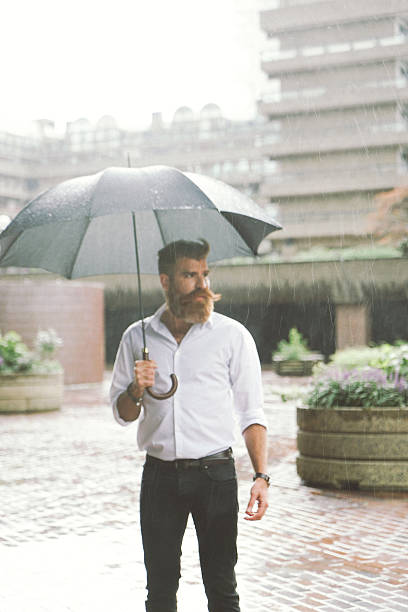 istock Businessman With Umbrella In The Rain 508097144