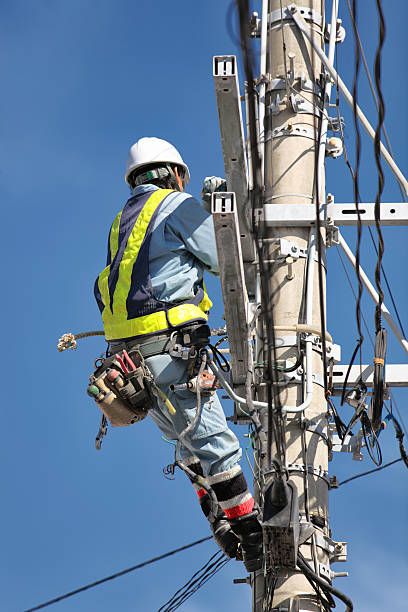 istock Electrician on an electricity pylon 508097477