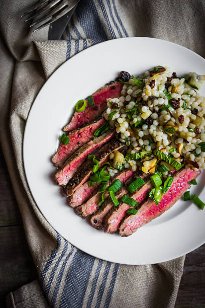 istock Sliced steak with couscous and vegetables 508097748