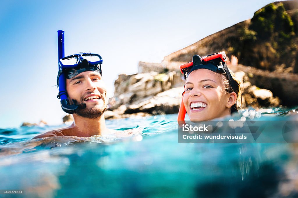 Couple Snorkeling Couple snorkeling on holiday Snorkeling Stock Photo