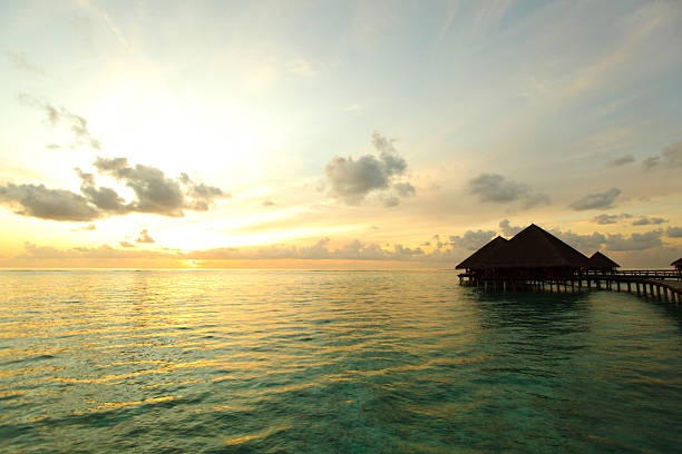 istock maldivian houses on sunrise 508098073