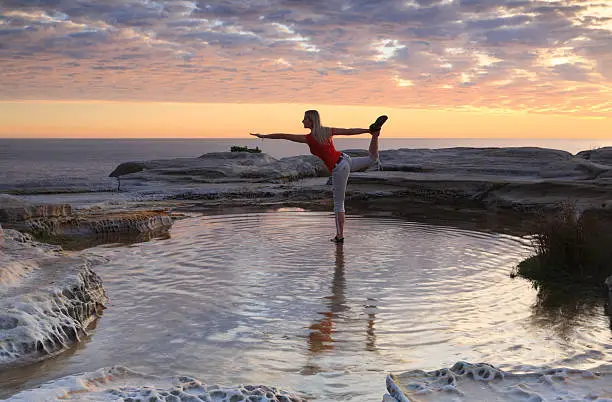 King Dancer Pose - Natarajasana by the sea during sunrise.  Maroubra Australia