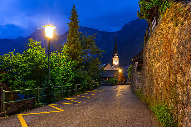 Streets of Hallstatt village in Alps at night, Austria
