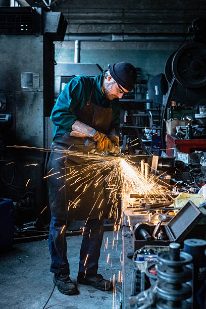 Craftsman repairman working with grinder