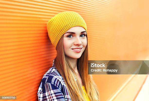Portrait Closeup Beautiful Young Girl In Yellow Hat Over Colorful Stock Photo - Download Image Now