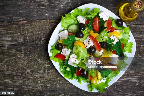 Greek Salad With Fresh Vegetables Feta Cheese And Black Olives Stock Photo - Download Image Now