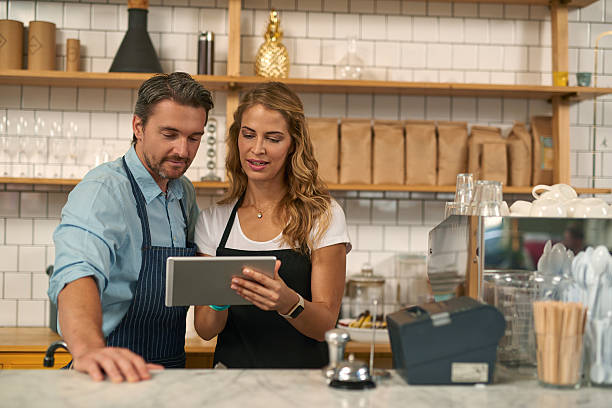 istock Baristas using digital tablet in coffee shop 508107176