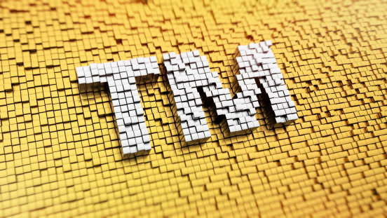 Pixelated TM sign made from cubes, mosaic pattern