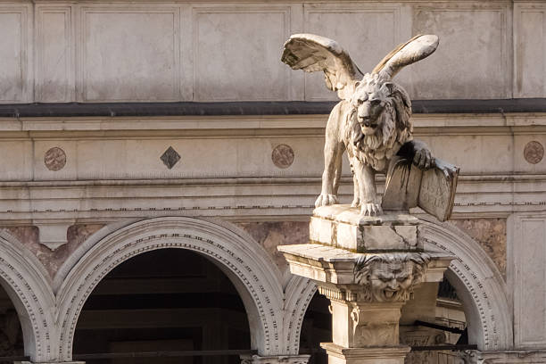 The Winged Lion of Saint Mark is featured on the Torre dell'Orologio, surrounded by a stunning mosaic sky filled with golden stars in Venice.