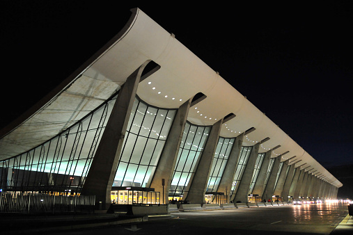 Dulles, Virginia, USA: Washington Dulles International Airport - main terminal at night - architect Eero Saarinen - the roof is a suspended catenary - IAD - photo by M.Torres