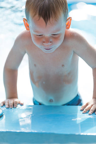 istock Little boy in water park 508125115