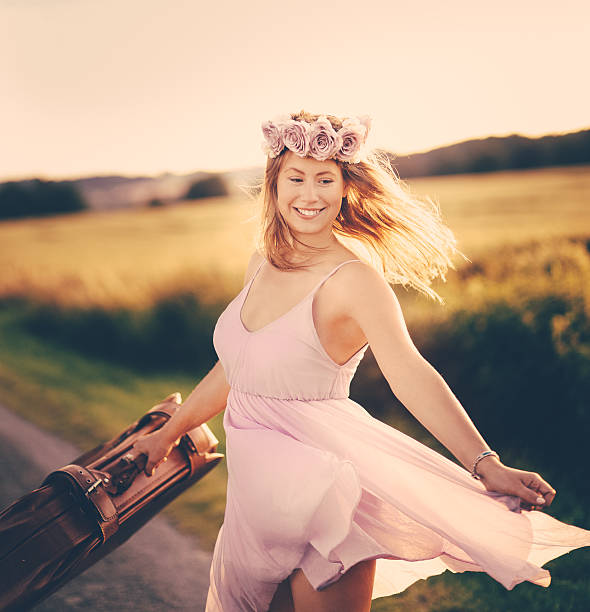 Girl running alongside country road
