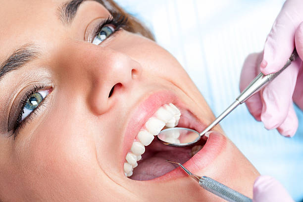 istock Dentist working on girls teeth 508126371