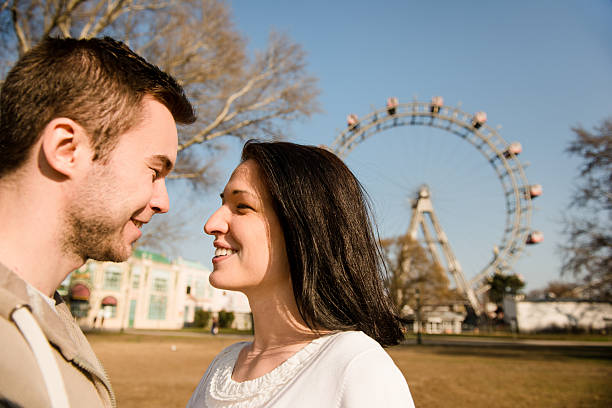 istock Young couple dating in amusement park 508126468