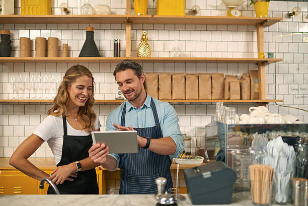 istock Baristas using digital tablet in coffee shop 508126488