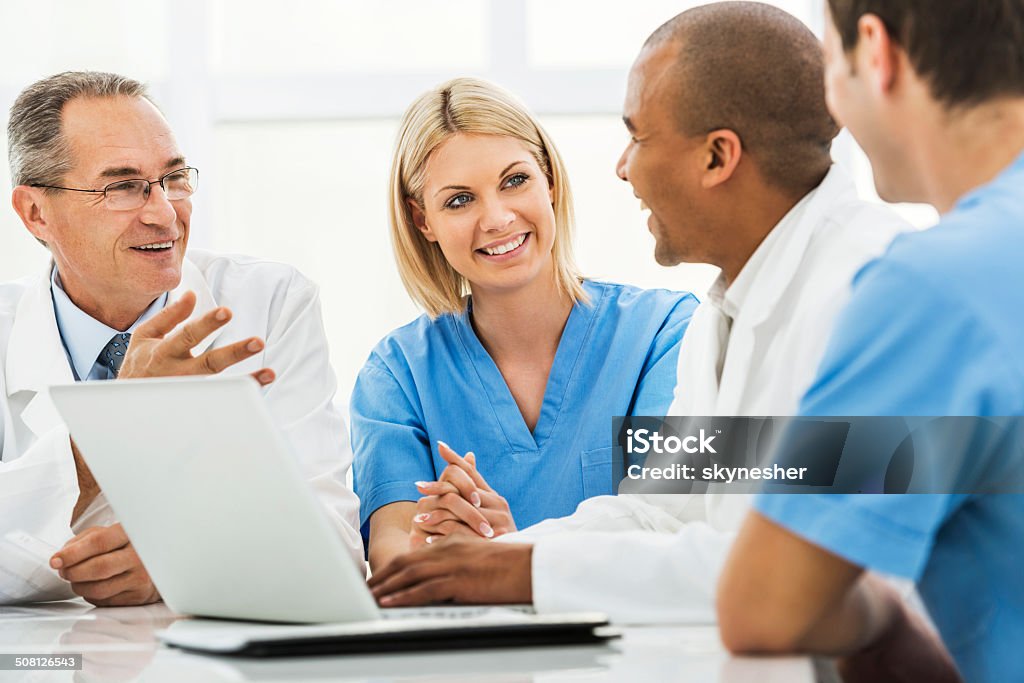 Doctors on a meeting. Group of doctors talking on a meeting.    Healthcare And Medicine Stock Photo