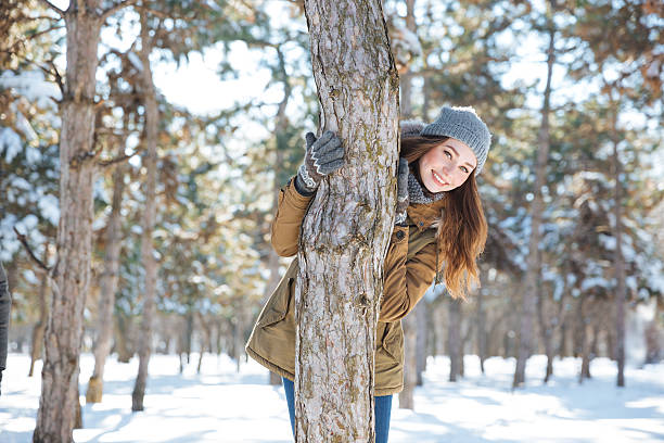 istock Smiling woman walking in winter park 508128376