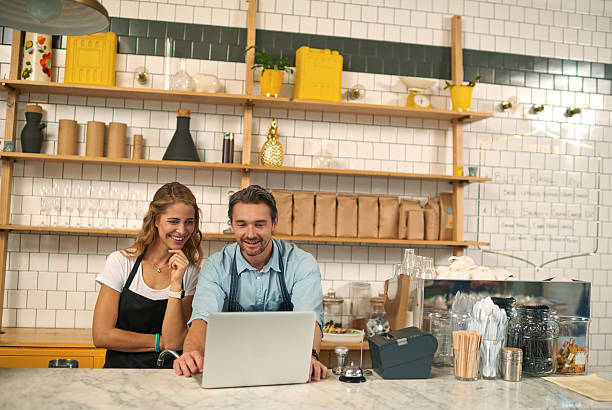 istock Baristas using laptop in coffee shop 508129712