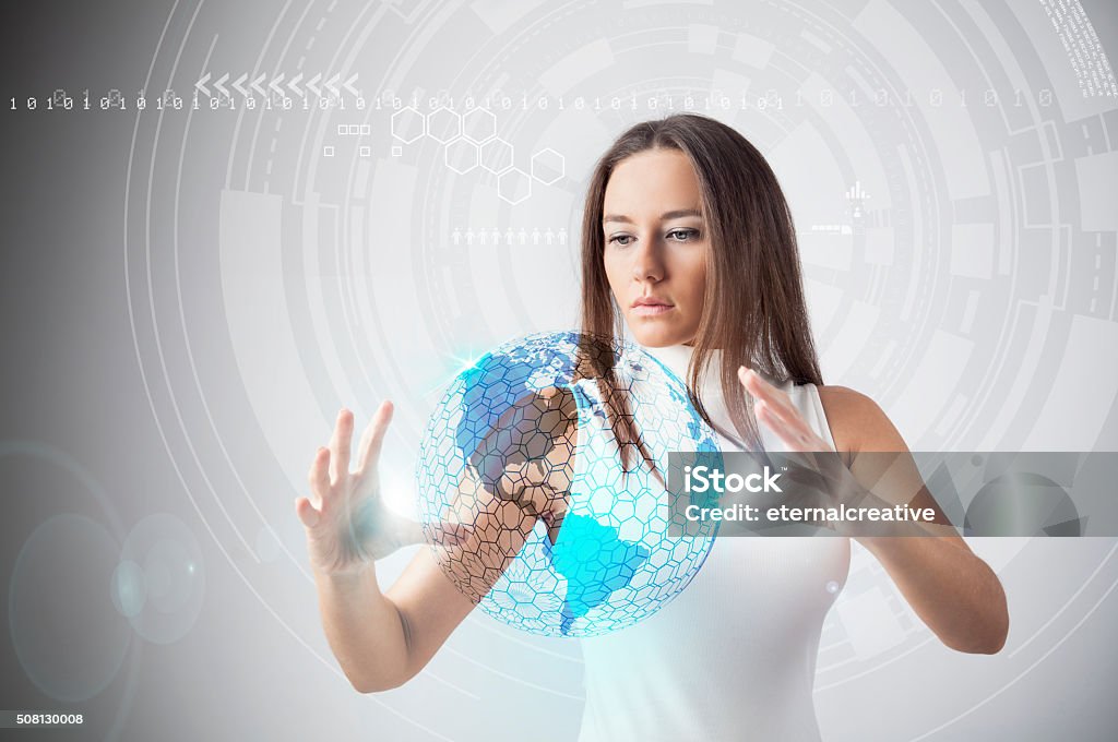Future Technology Young woman working with earth globe hologram Futuristic Stock Photo