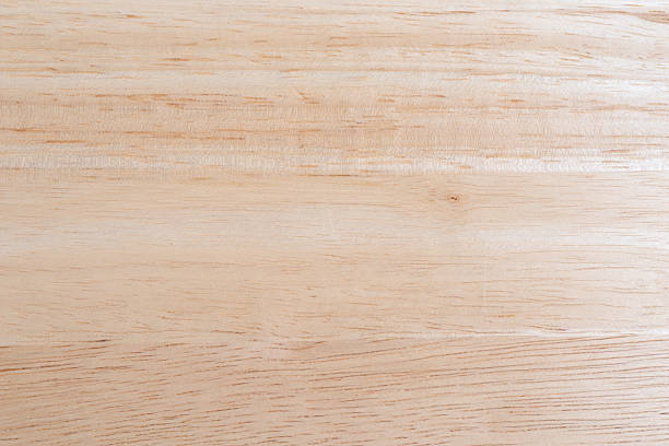 Wood table top illuminate with natural light A clean wood glued table top illuminated with natural light. directly above stock pictures, royalty-free photos & images