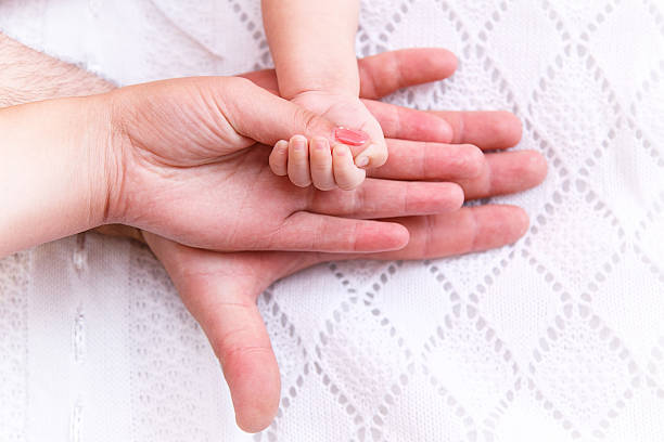istock Hand dad mom baby 508130592