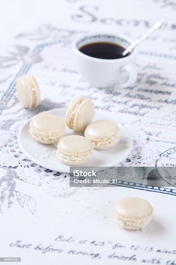 Coconut Macarons with White Chocolate Cream Cheese Filling Coconut Macarons with White Chocolate Cream Cheese Filling, on a white plate. Almond Stock Photo