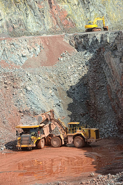 istock excavator loading a dumper truck in a quarry 508132552