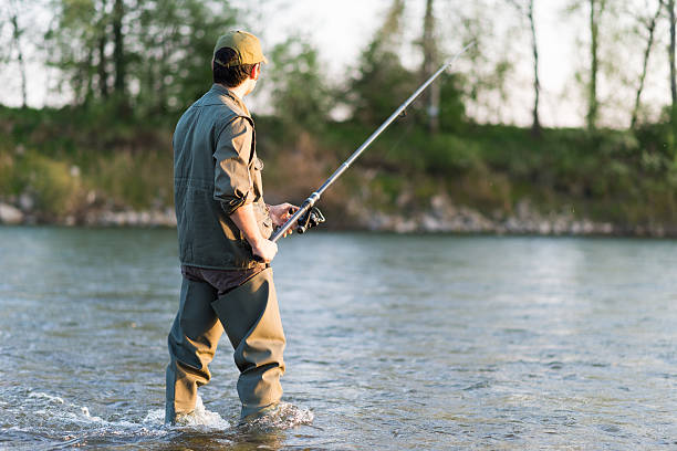 istock Fisherman fishing in a river 508135516