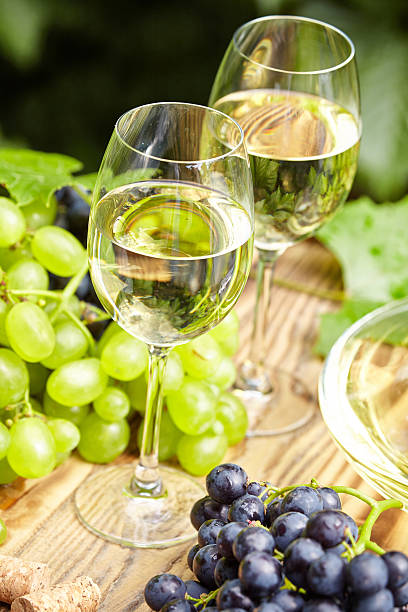 istock Grape and white wine on wooden barrel , garden terrace 508136722