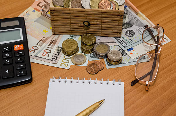 istock open treasure chest with coin. Us dollar and euro, notepad 508136972