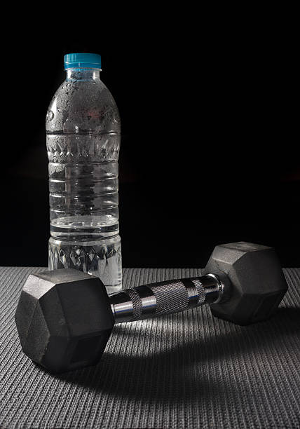 istock Metal dumbbell with water bottle. 508137352
