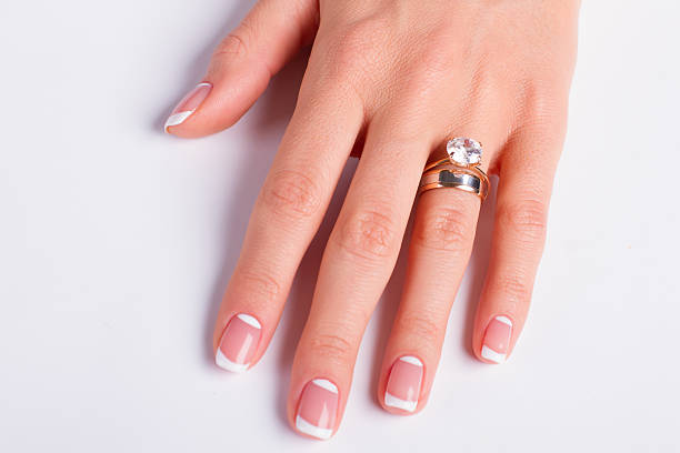 istock Diamond ring and wedding ring on woman's finger. 508138322