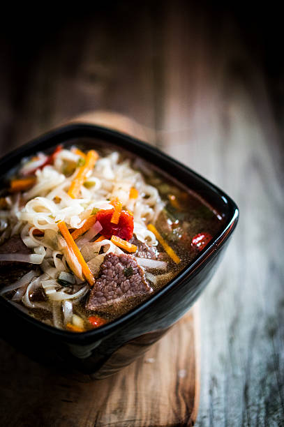 Pho soup on wooden background