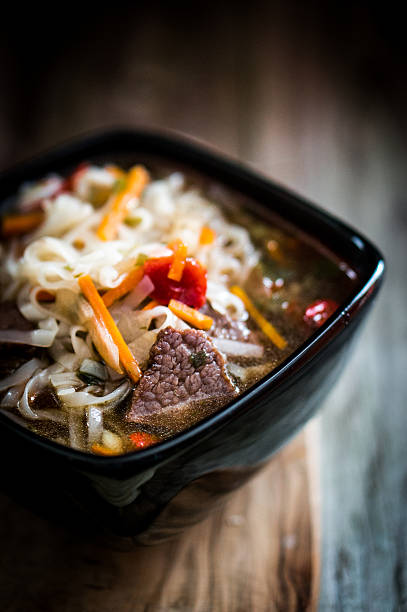 Pho soup on wooden background